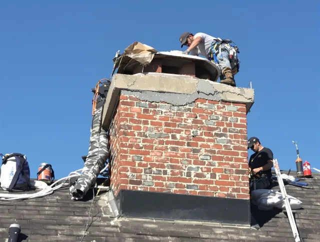Southington Chimney Sweep installing a custom chimney crown in Southington, CT