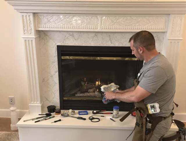 Southington Chimney Sweep performing fireplace maintenance in Southington, CT