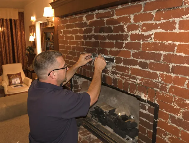 Southington Chimney Sweep expert fixing a fireplace in Southington, CT